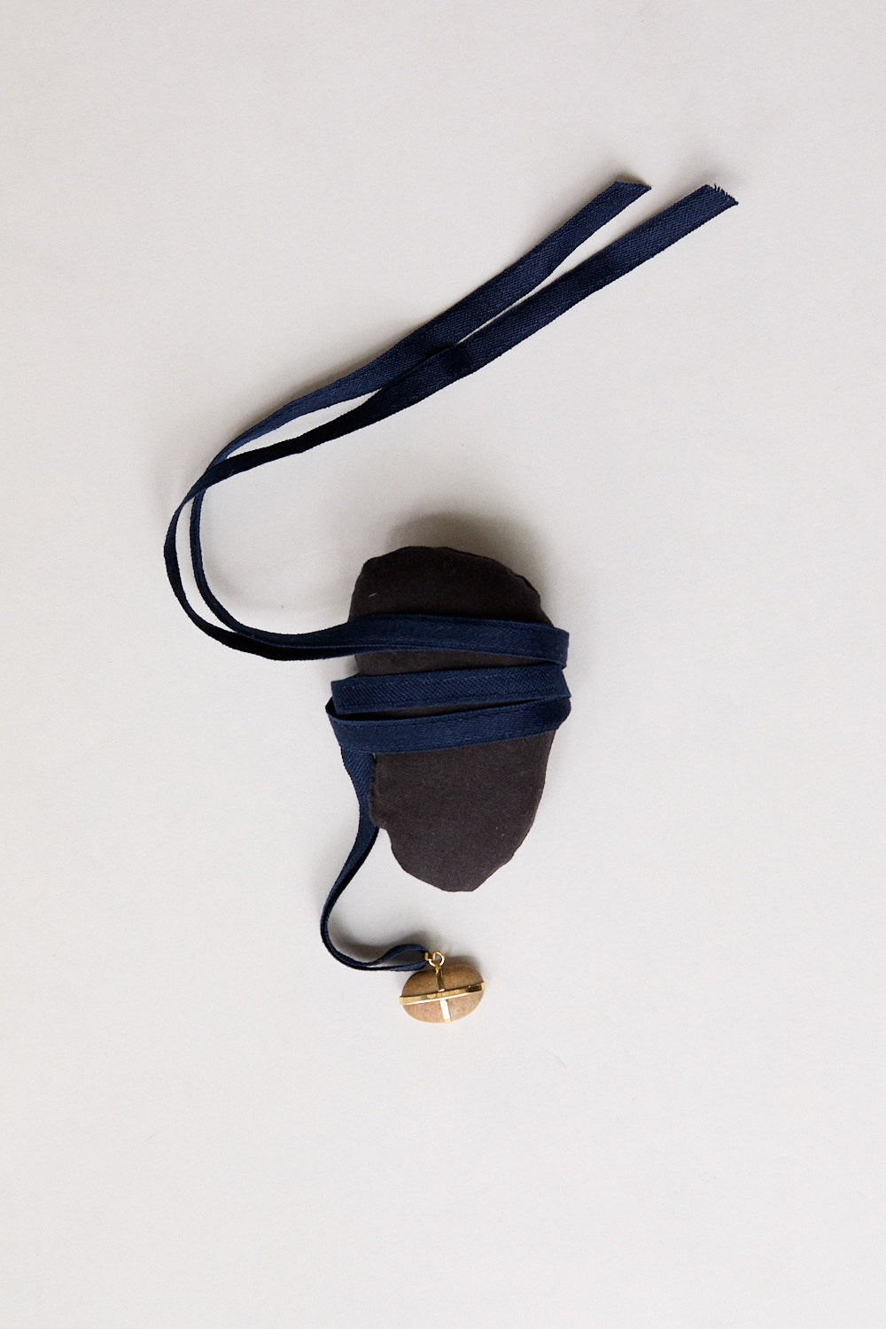 Bean stone pendant-18 carat gold ribbon