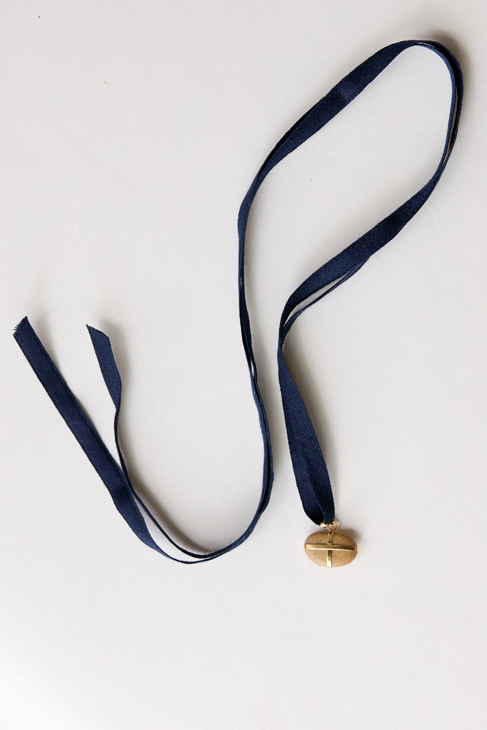 Bean stone pendant-18 carat gold ribbon