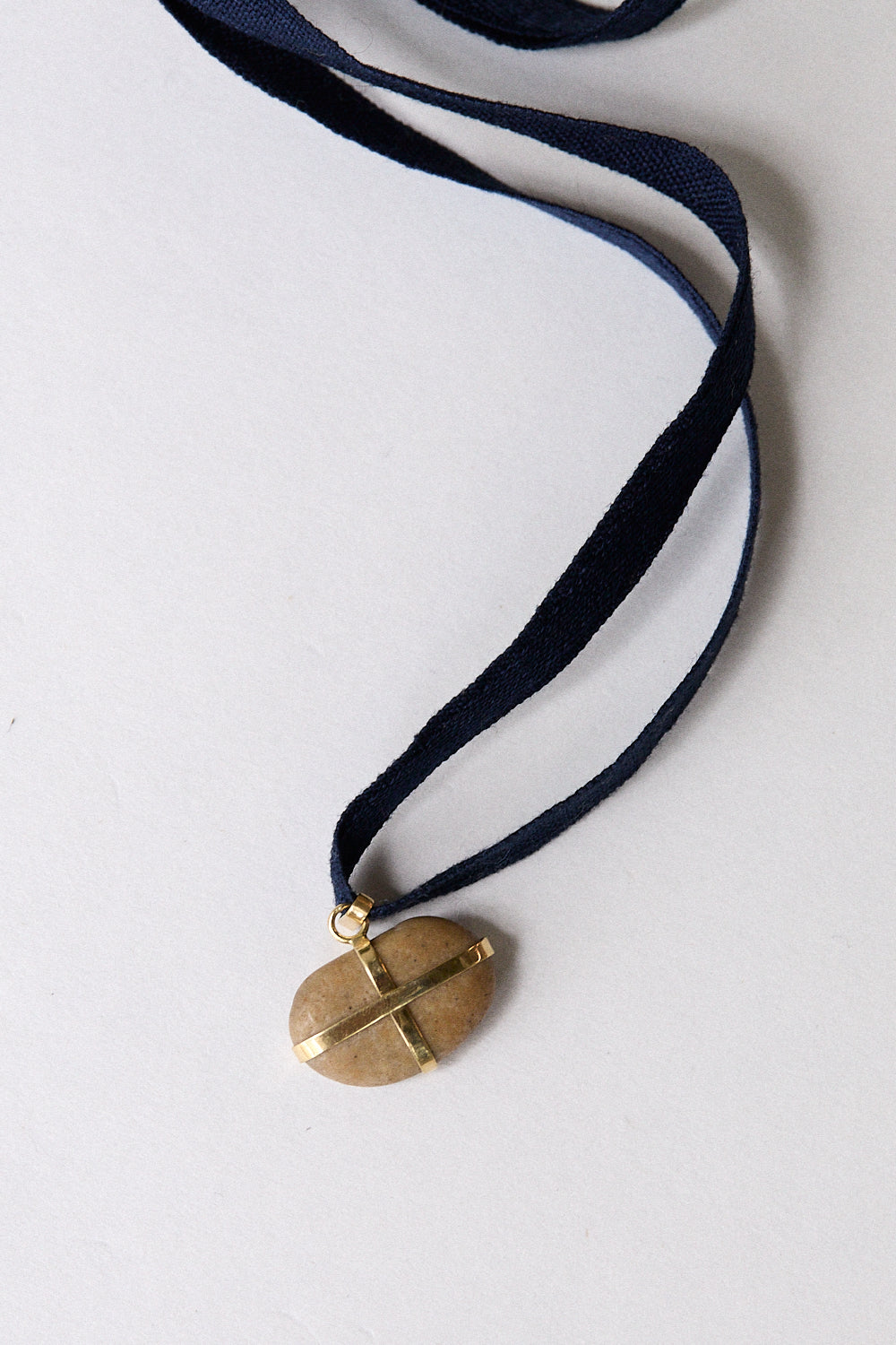 Bean stone pendant-18 carat gold ribbon