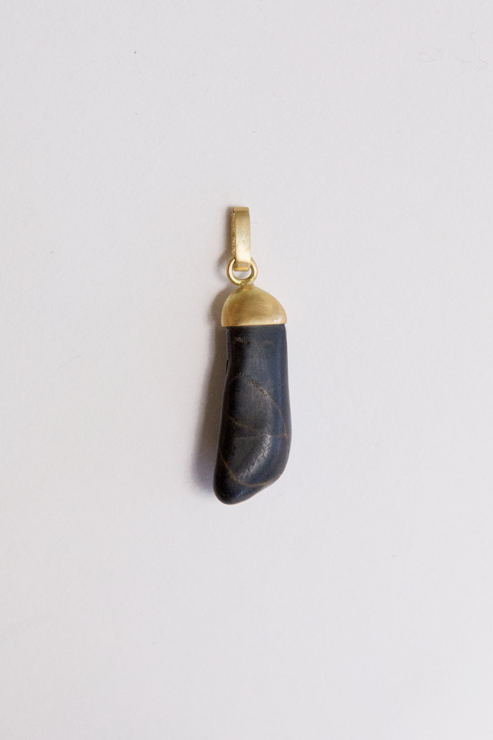 Black stone pendant- 18 carat gold cap