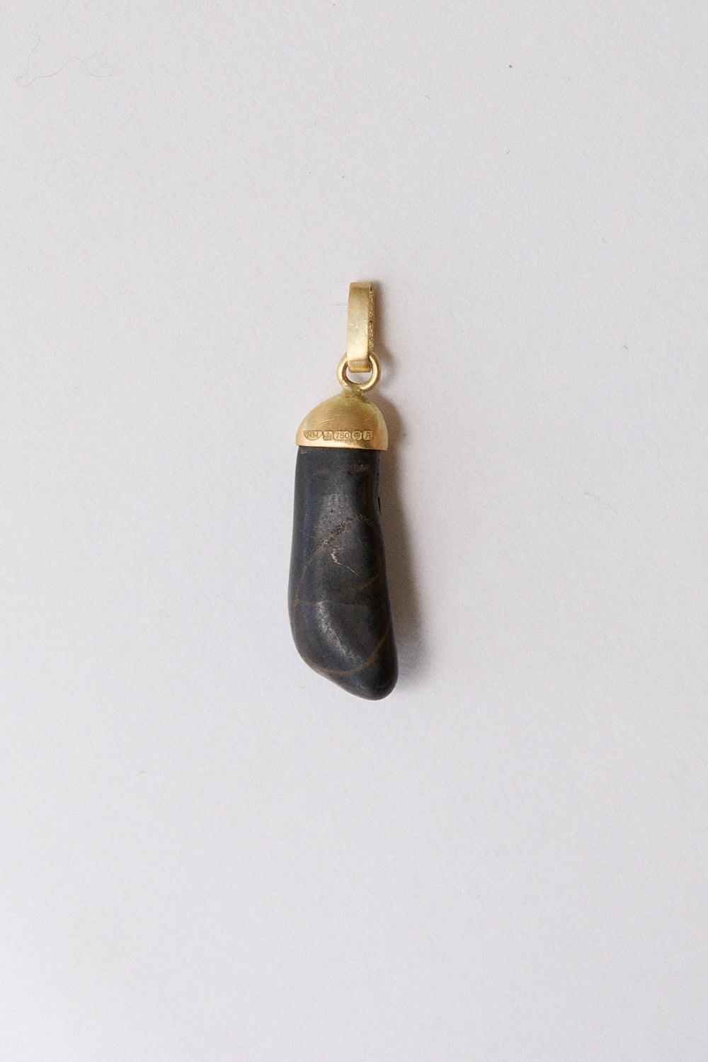 Black stone pendant- 18 carat gold cap