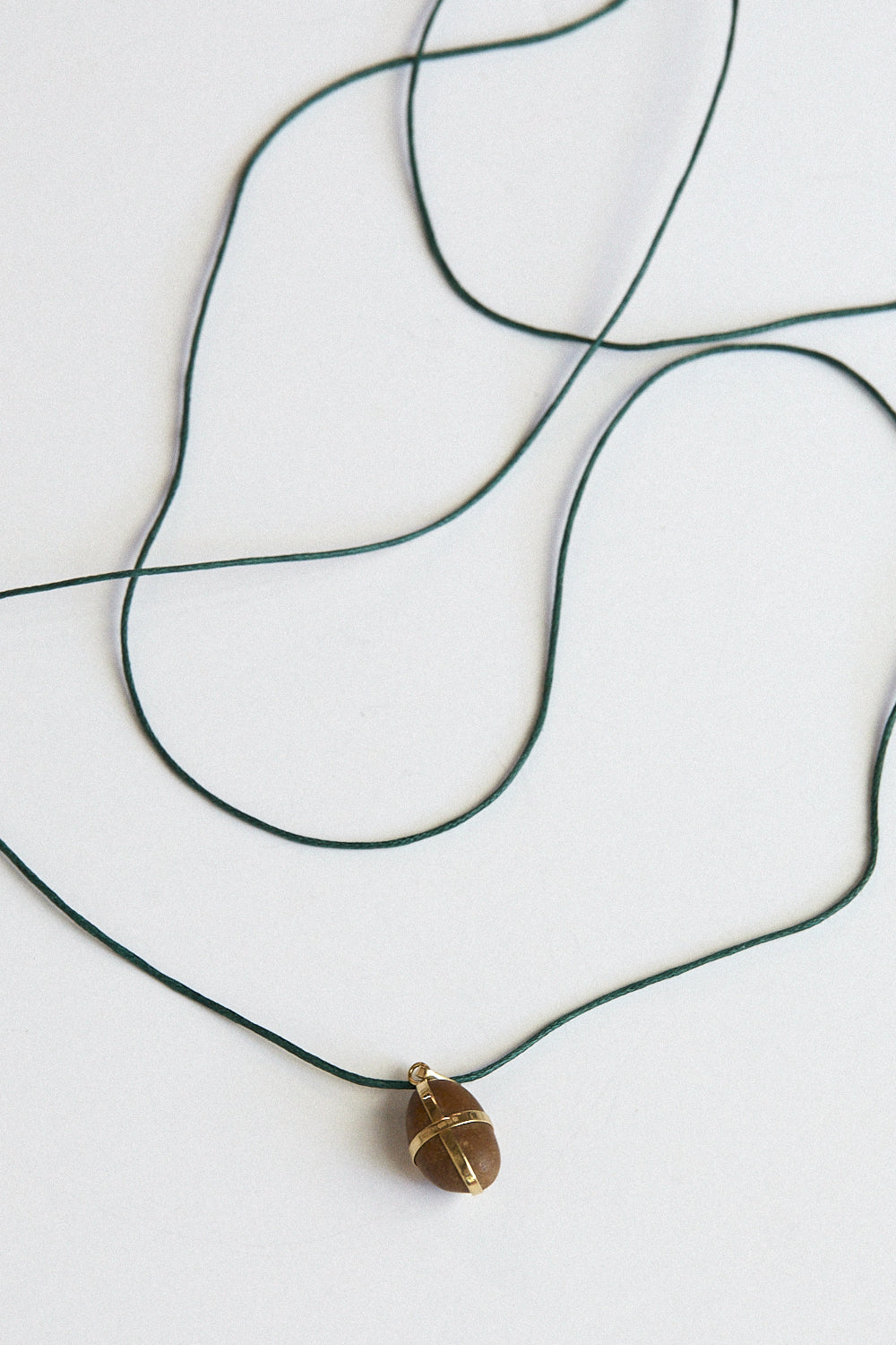 Caramel stone pendant-18 carat gold ribbon