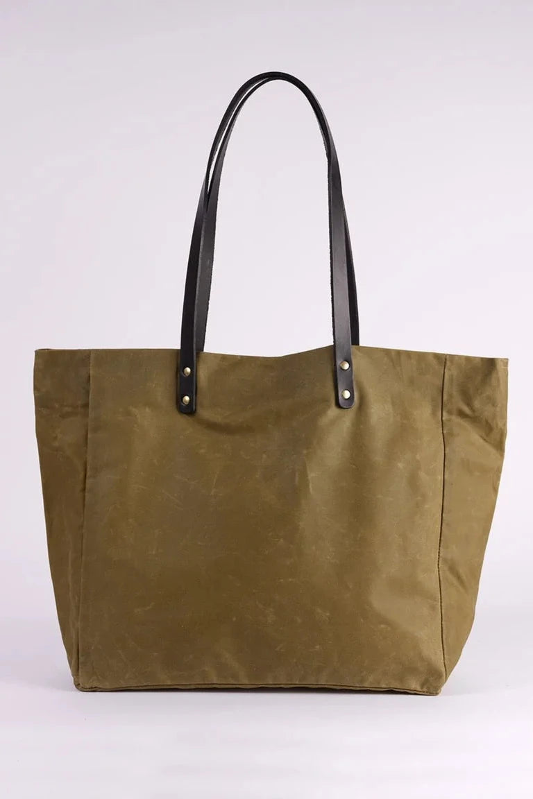 Brown tote bag with black handles on a white background