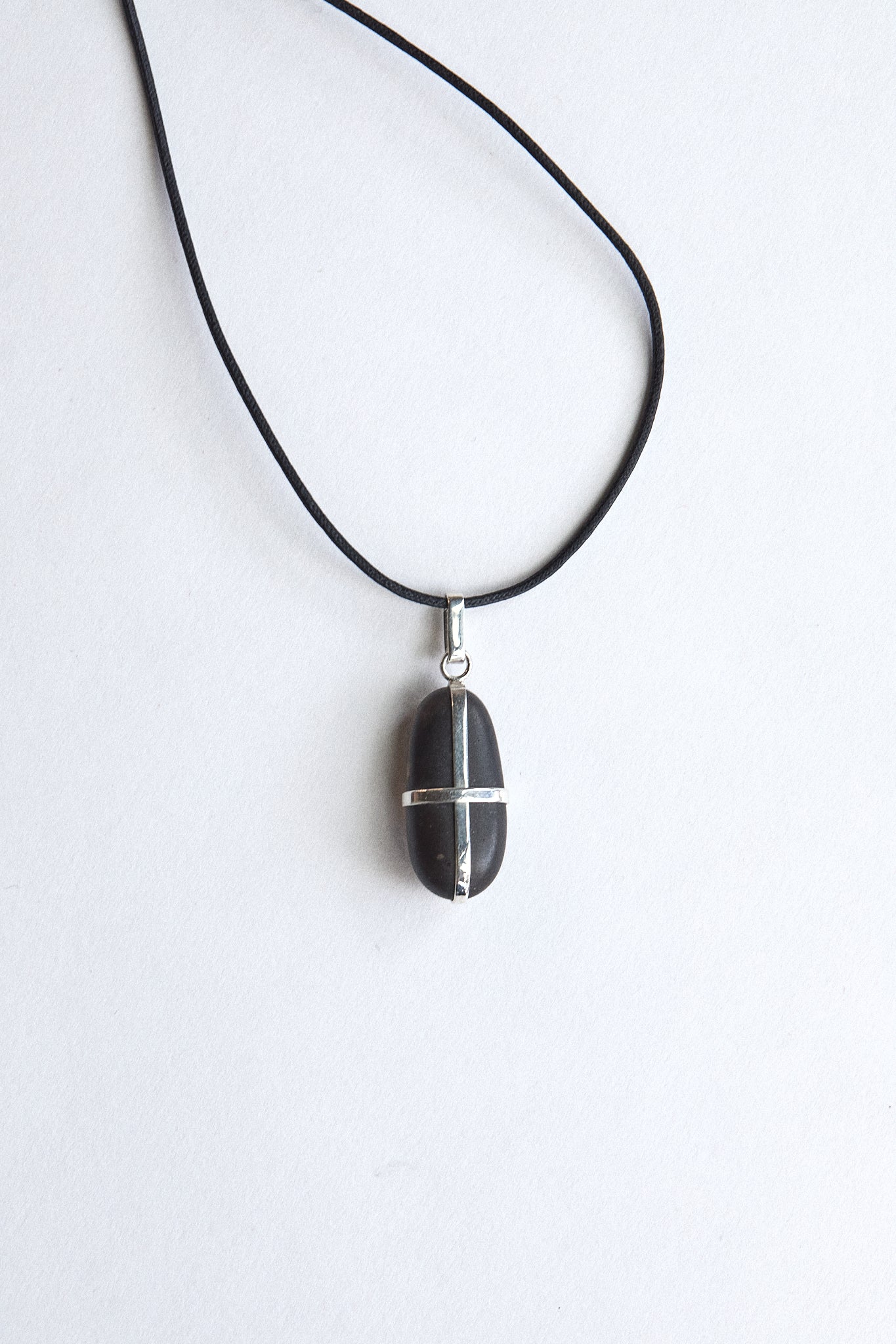 Elongated Black Stone - Sterling Silver ribbon setting