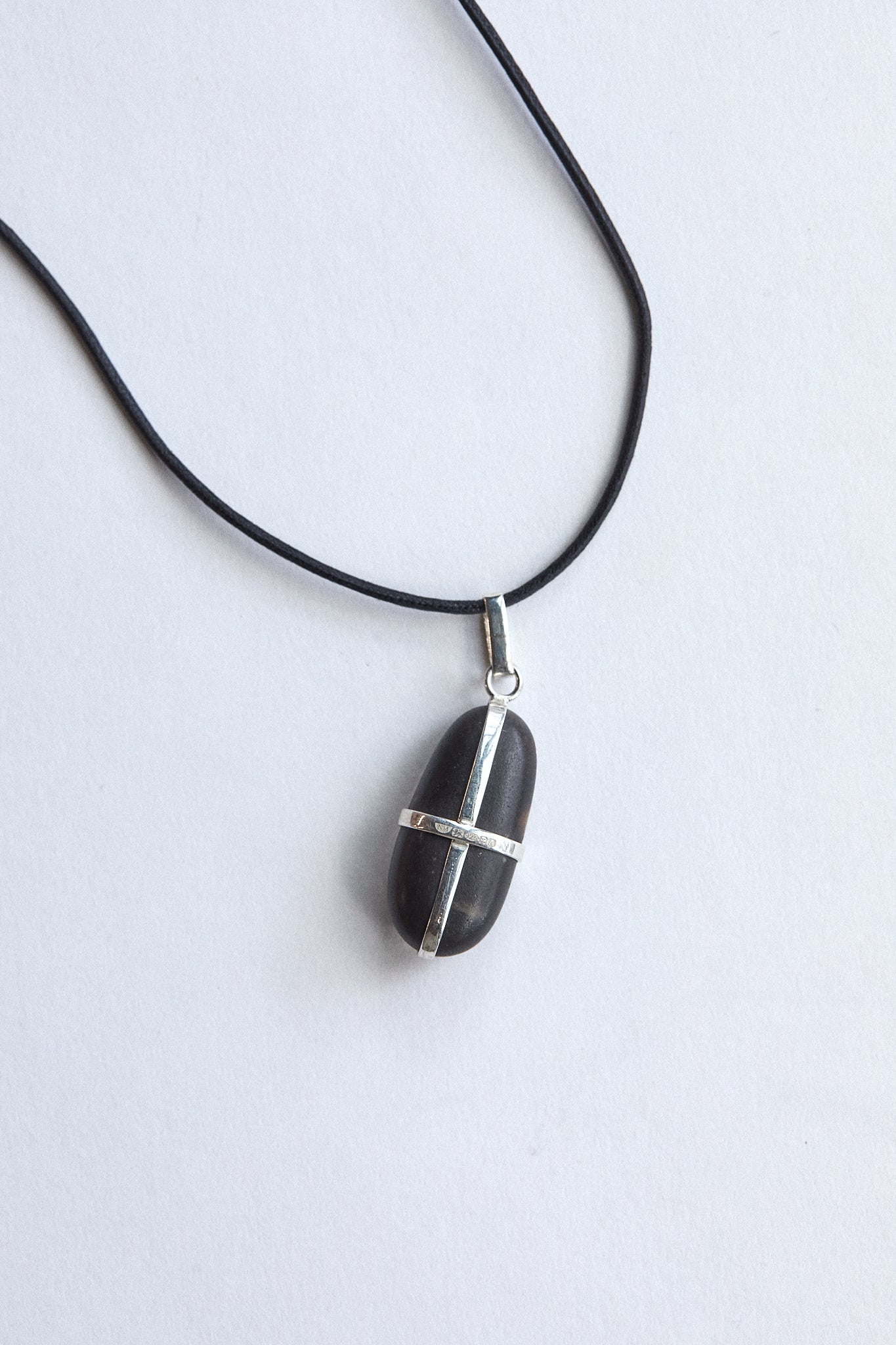 Elongated Black Stone - Sterling Silver ribbon setting